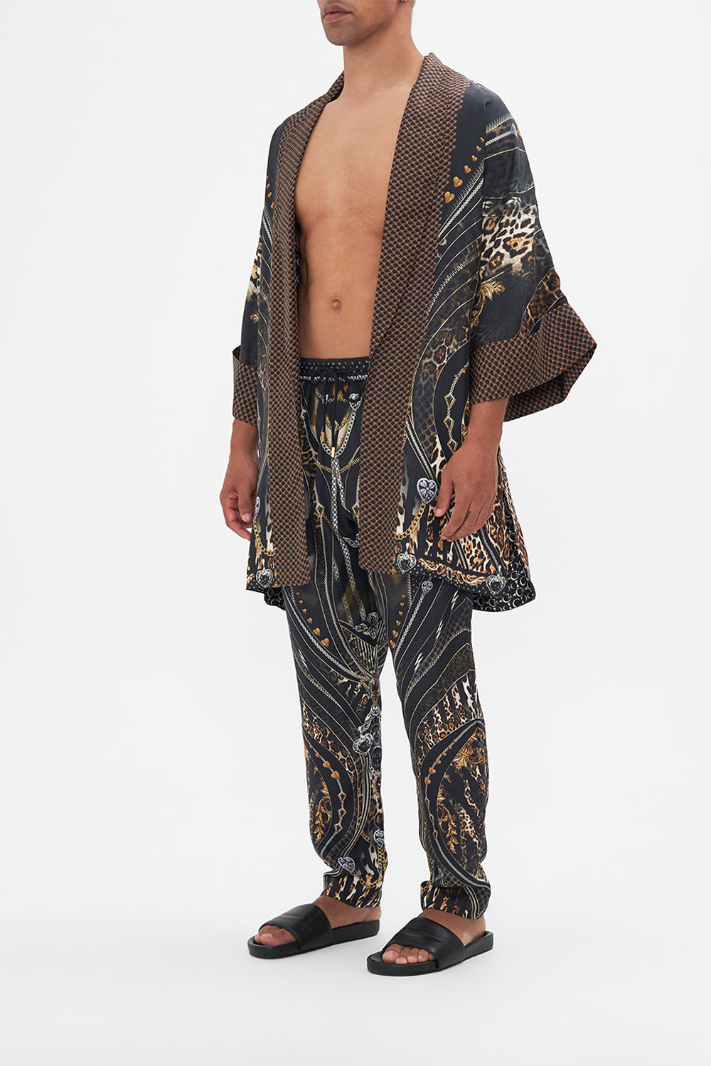 Side view of model wearing Hotel Franks by CAMILLA mens silk robe in Chaos In The Cosmos animal print