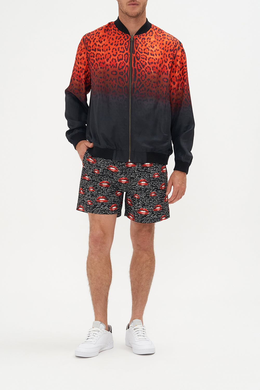Front view of model wearing Hotel Franks by CAMILLA mens reversible bomber jacket in black and red Chaos Magic print