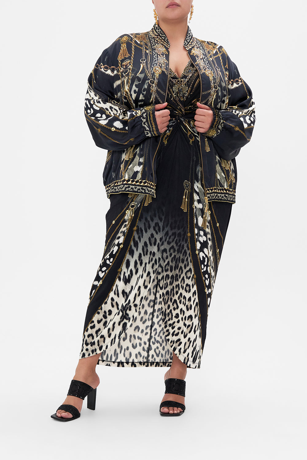 Front view of curvy model wearing CAMILLA plus size silk bomber jacket in Untamed Royalty print