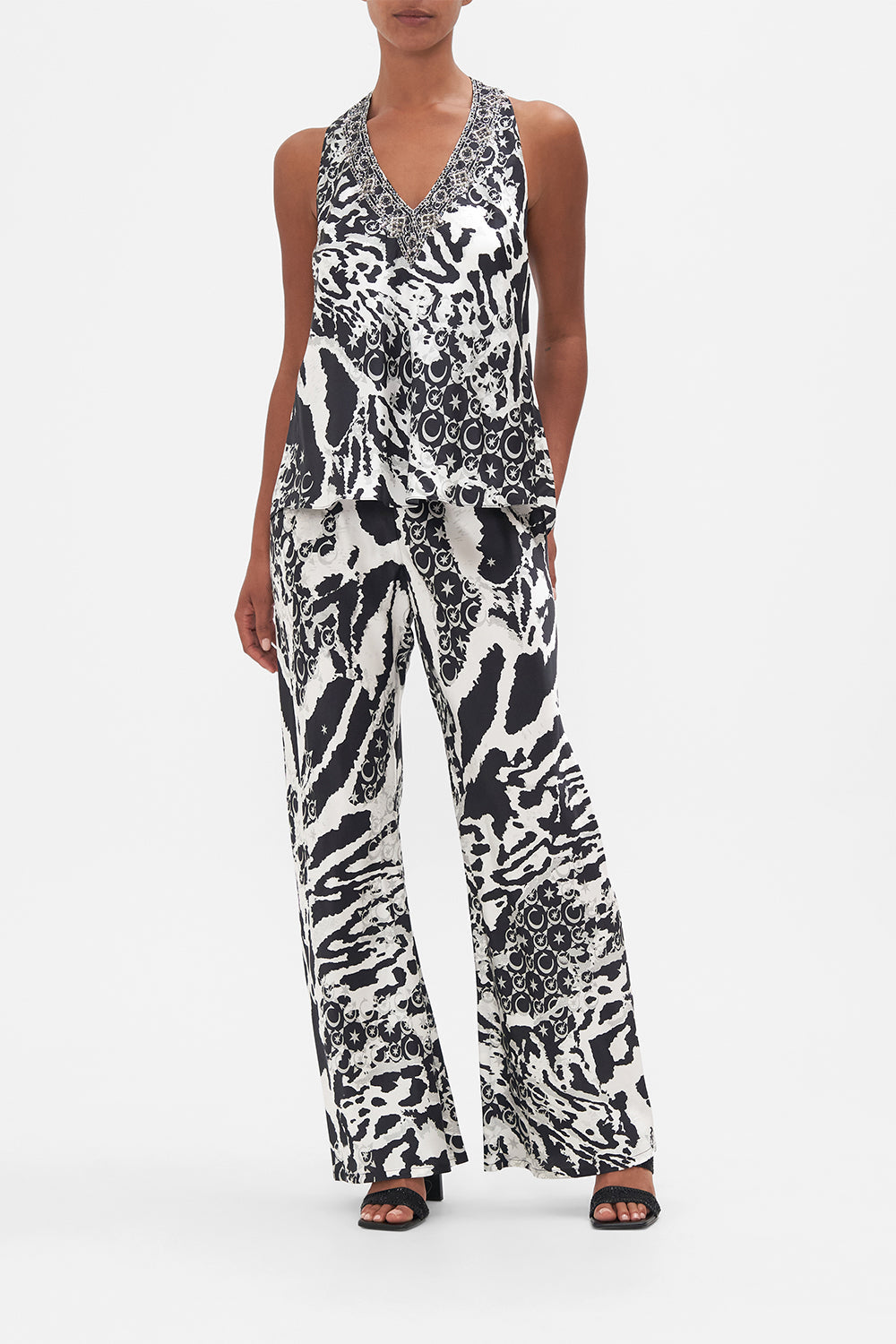 Front view of model wearing CAMILLA silk top in black and white Fe;ine Fantasy print