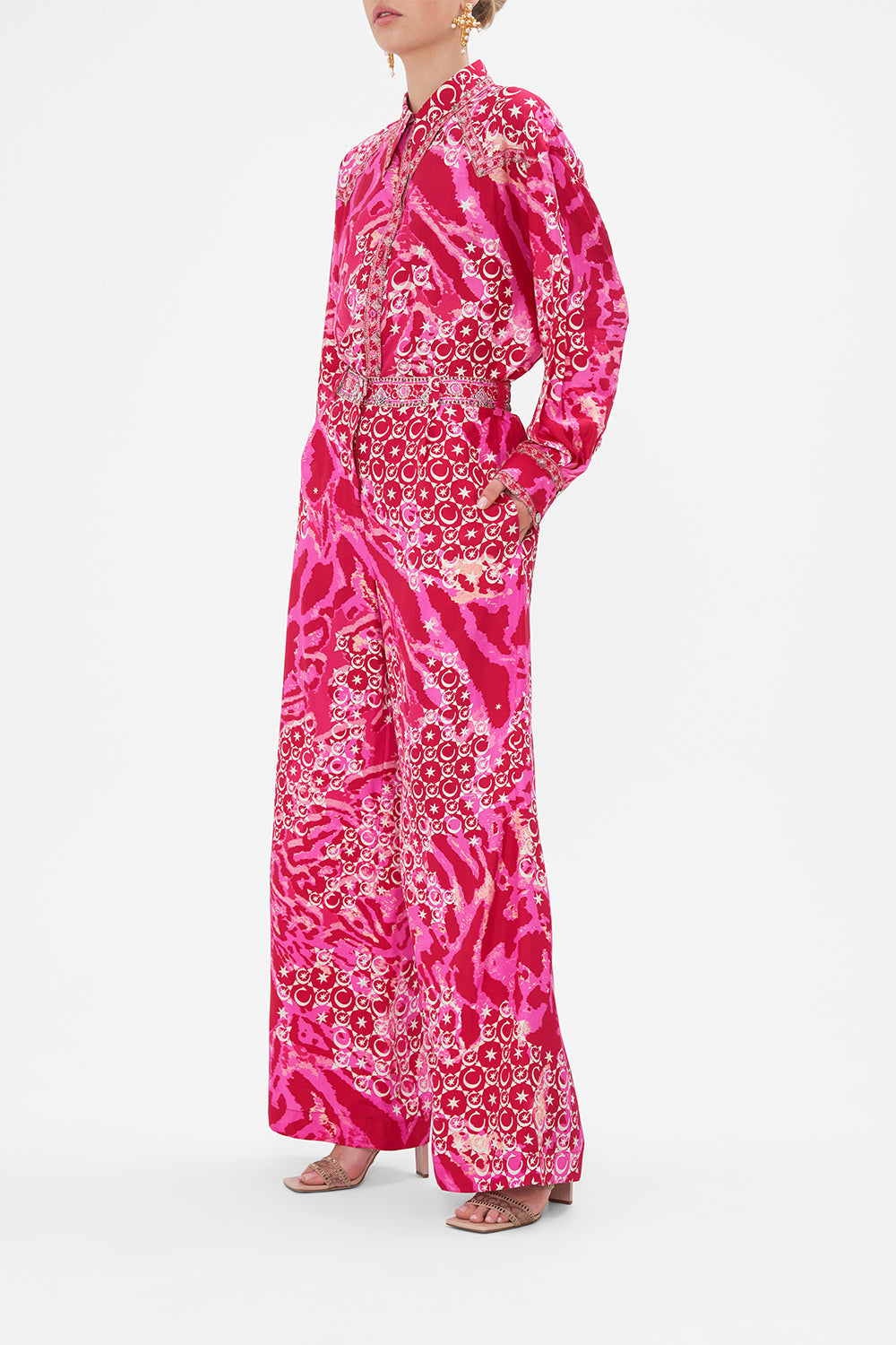 Side view of model wearing CAMILLA silk palazzo pants in Song Of Sacrifice print