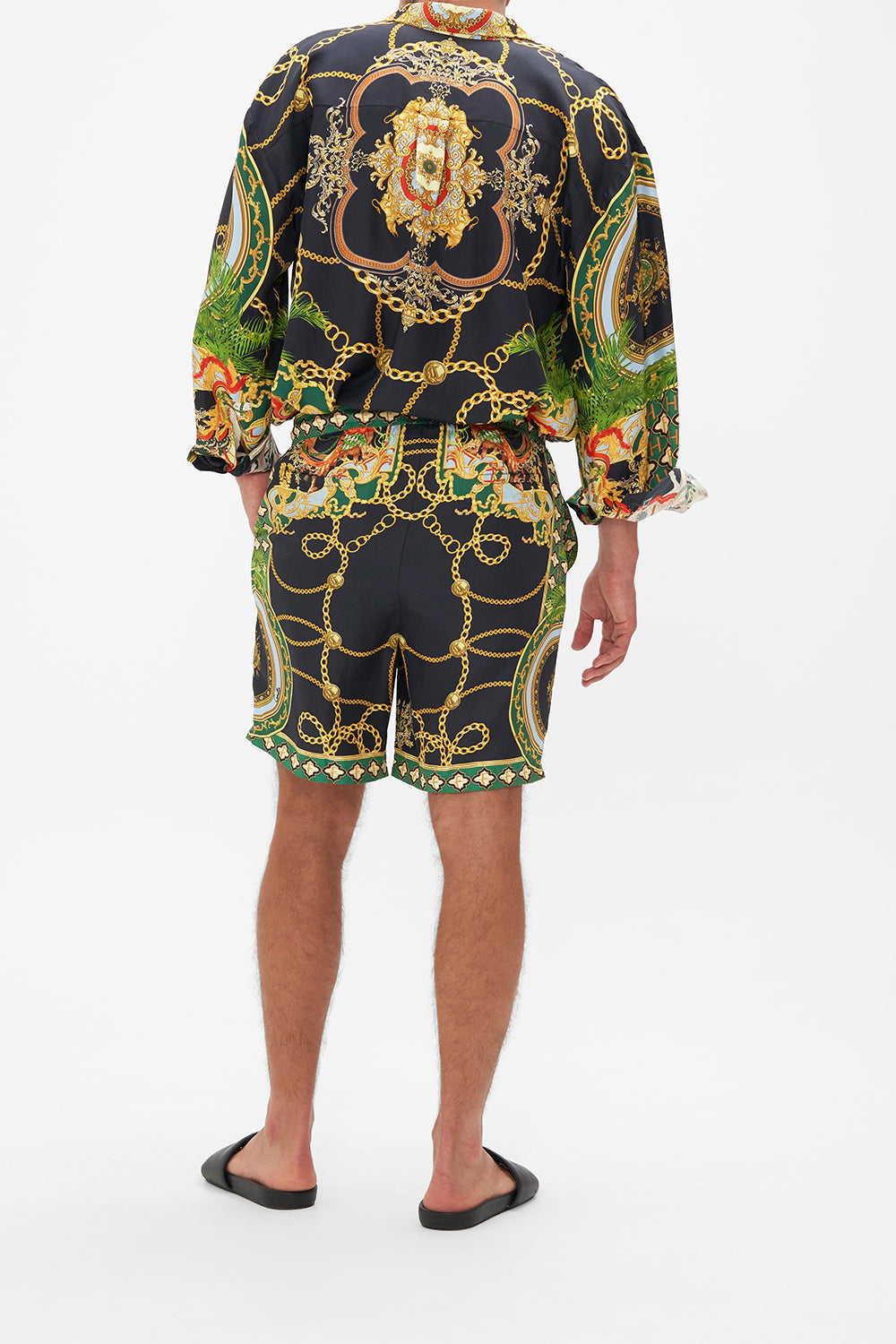 Back view of model wearing Hotel Franks By CAMILLA mens walkshorts in Jealousy And Jewels print