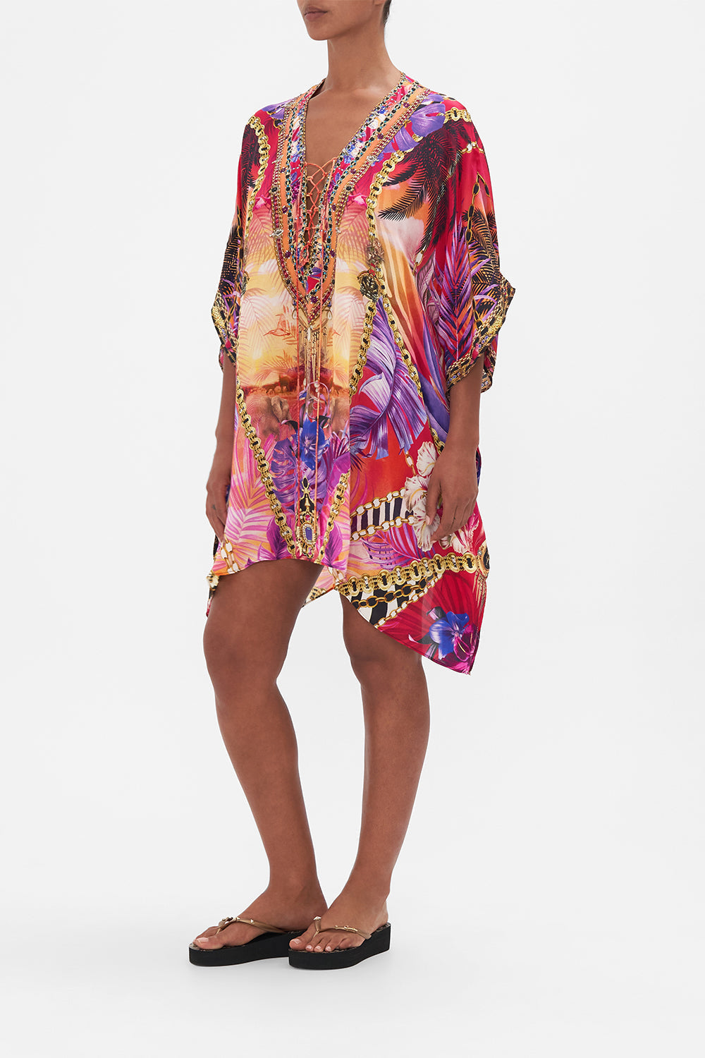 Crop view of model wearing CAMILLA resortwear silk kaftan in Wild Loving print