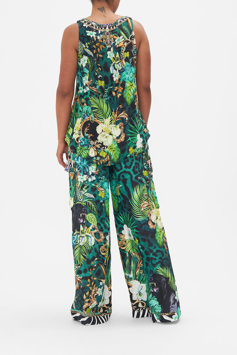 Back view of model wearing CAMILLA green silk tank top in Sing My Song print