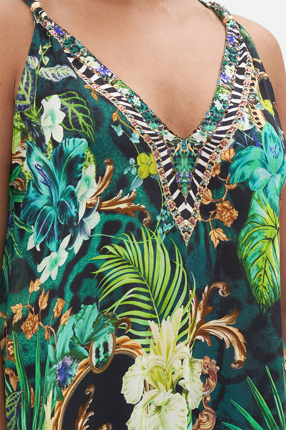 Detail view of model wearing CAMILLA green silk tank top in Sing My Song print