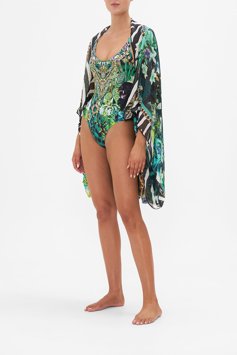 Side view of model wearing CAMILLA silk shrug in Sing My Song print