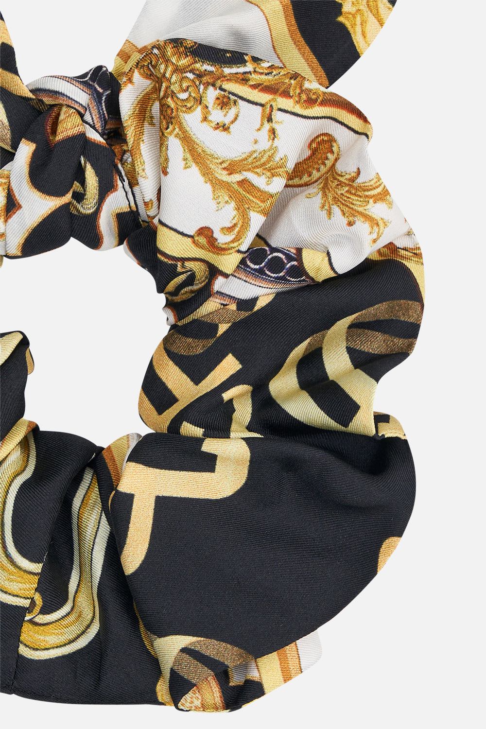Detail view of CAMILLA silk scrunchie in Tether Me Not print