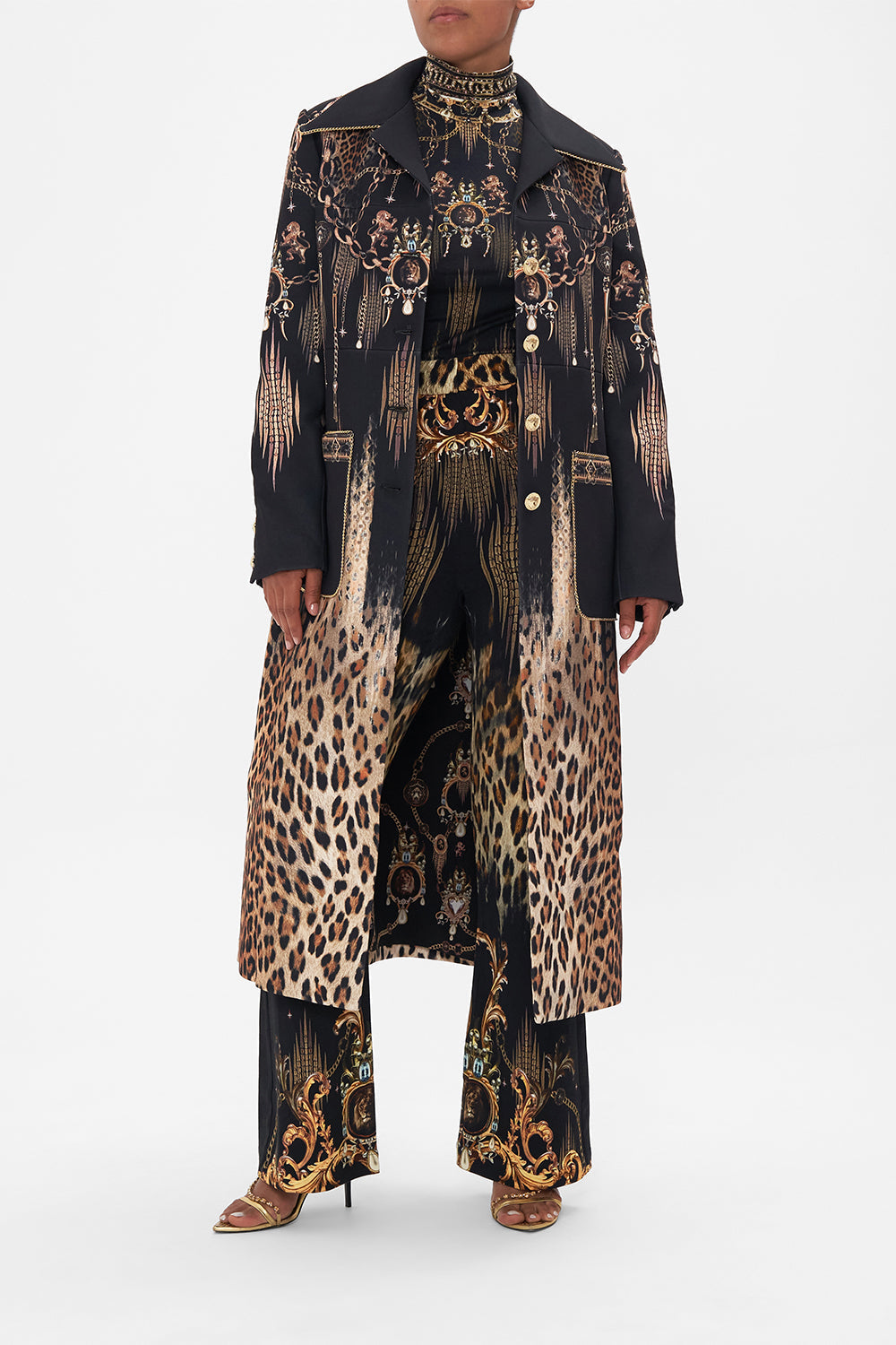 Front view of model wearing CAMILLA black button front coat in Jungle Dreaming print