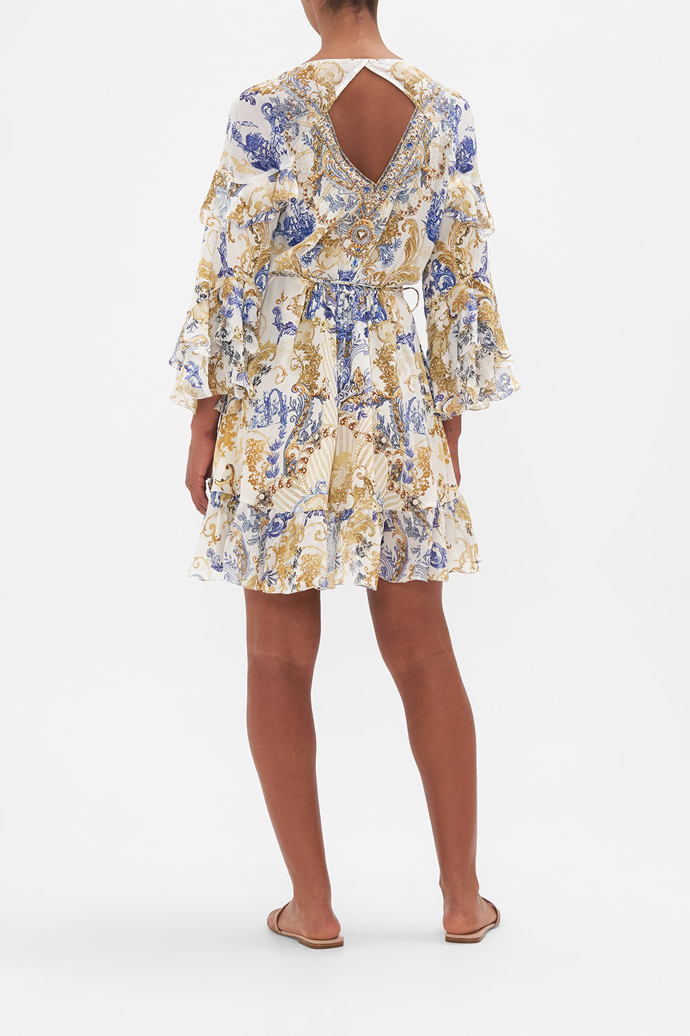 Back view of model wearing CAMILLA silk wrap dress in Soul Searching print