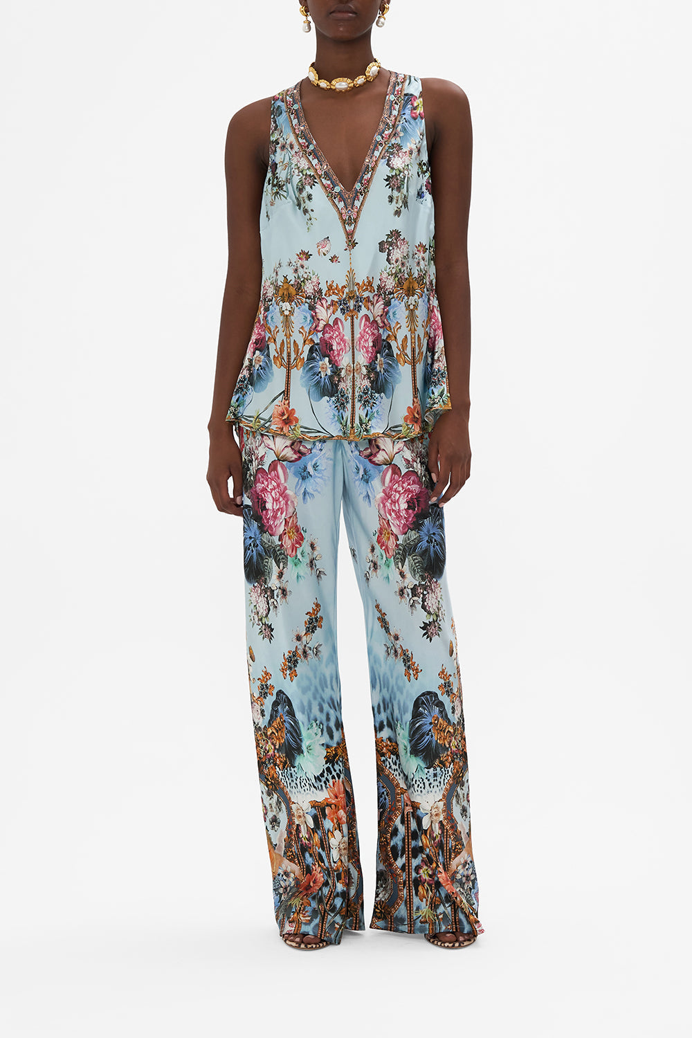 Front view of model wearing CAMILLA blue silk v neck top in Letters To Leo print