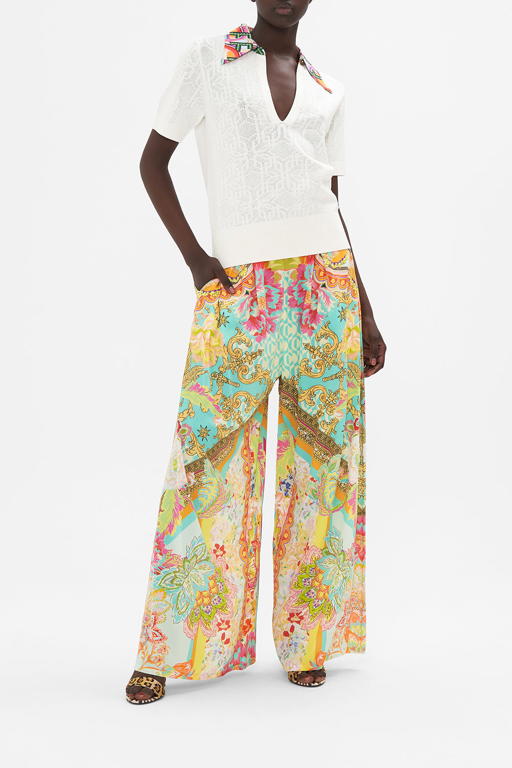 Front view of model wearing CAMILLA white knit polo top in An Italian Welcome print