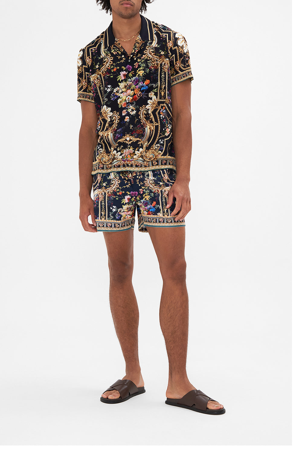 Front view of model wearing HOTEL FRANKS BY CAMILLA floral print mens short sleeve shirt in Play Your Cards Right print