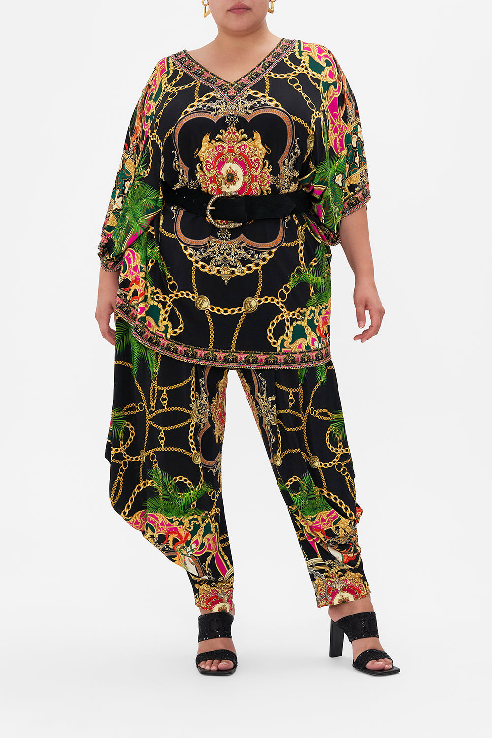 Front view of curvy model wearing CAMILLA plus size bat sleeve tunic in Jealousy And Jewels print