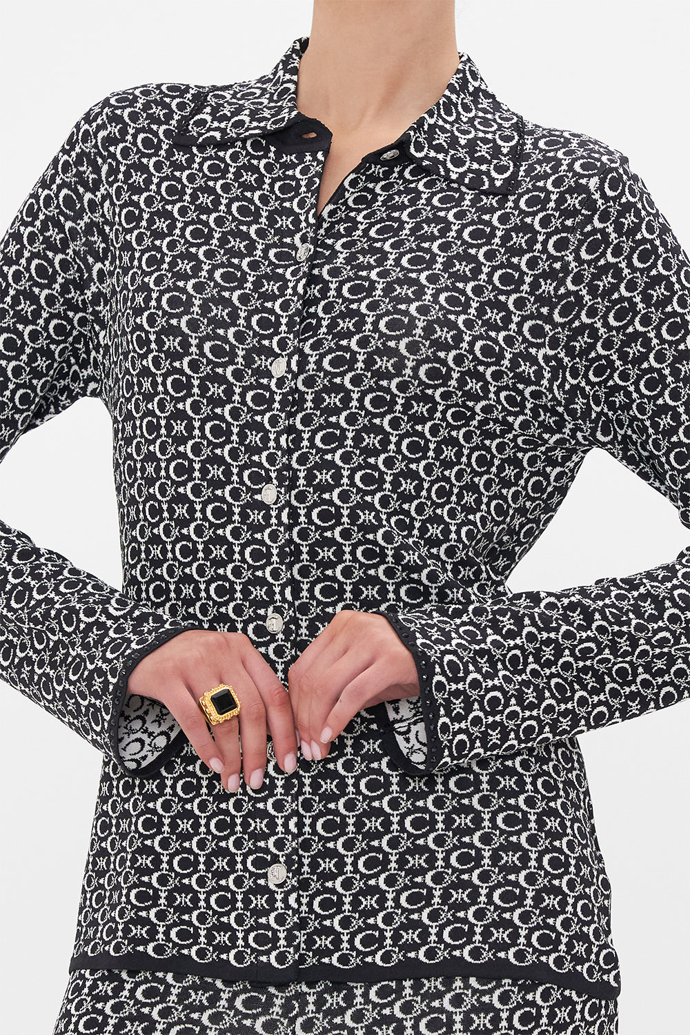 Detail view of model wearing CAMILLA knit shirt in Feline Fantasy printBack product