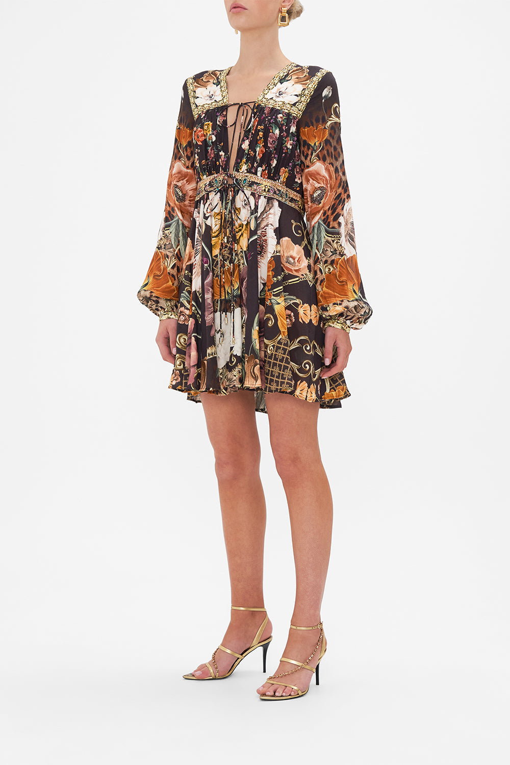 Side view of model wearing CAMILLA brown floral mini dress in Wave Your Wand print