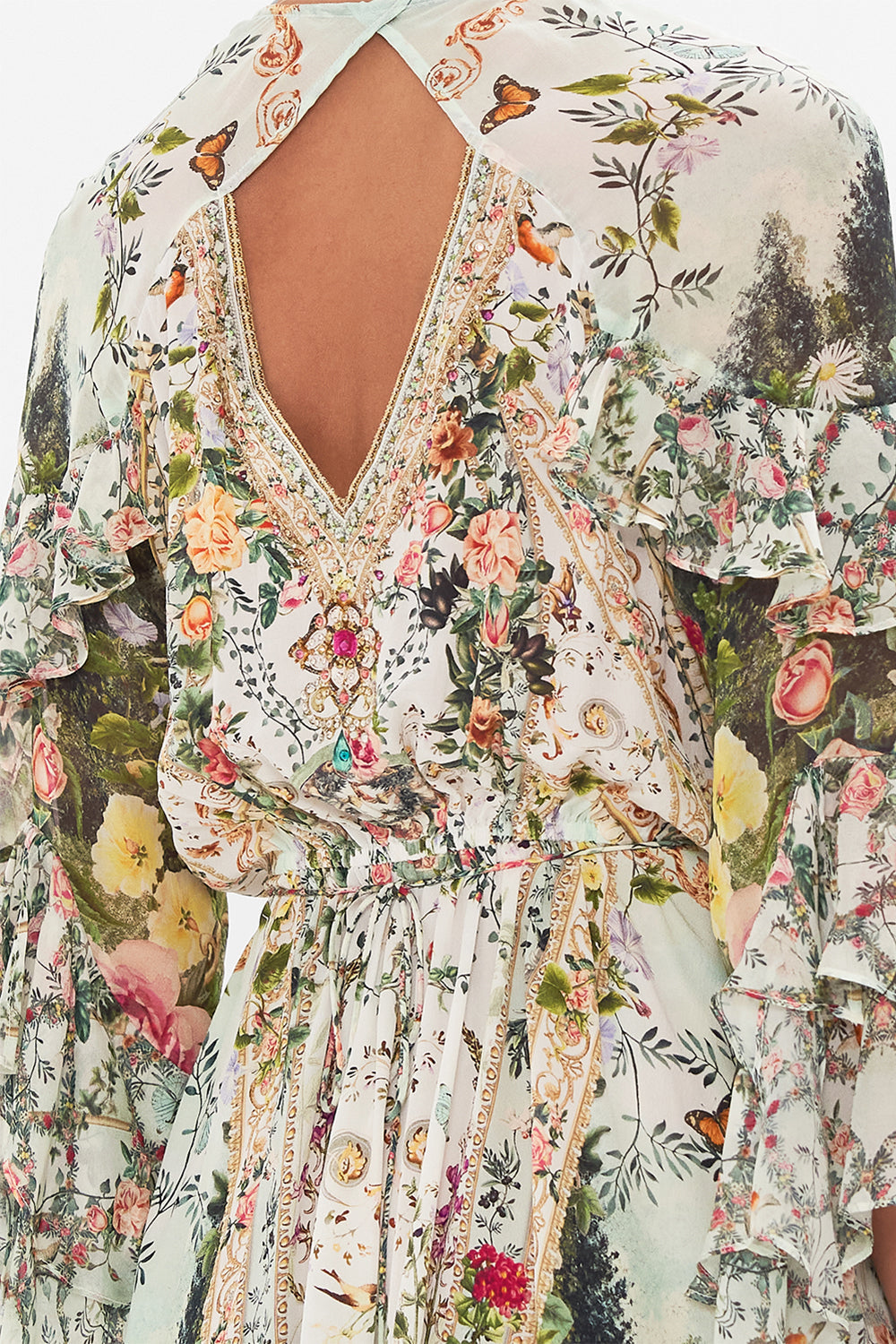 Detail view of model wearing CAMILLA silk wrap dress in Renaissance Romance print