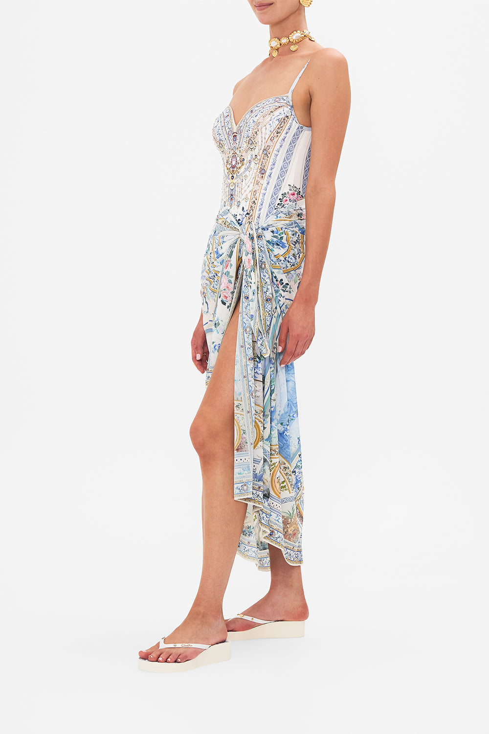 Side view of model waering CAMILLA long sarong in Season Of The Siren print