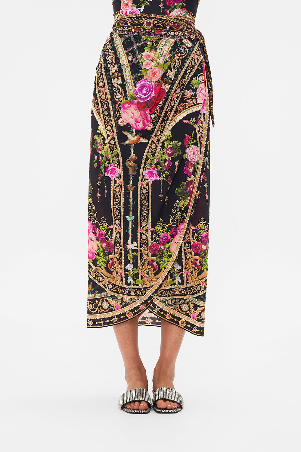 Crop view of model wearing CAMILLA resortwear draped sarong in Reseravtion For Love print