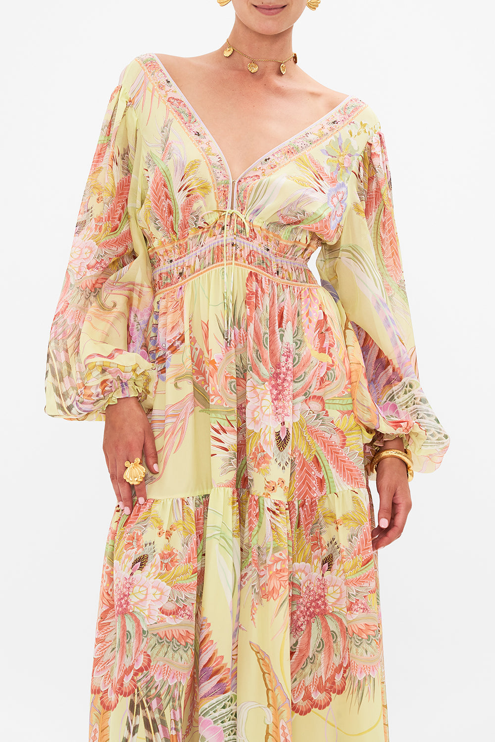 Crop view of model wearing CAMILLA long sleeve silk dress in Cosmic Tuscan print