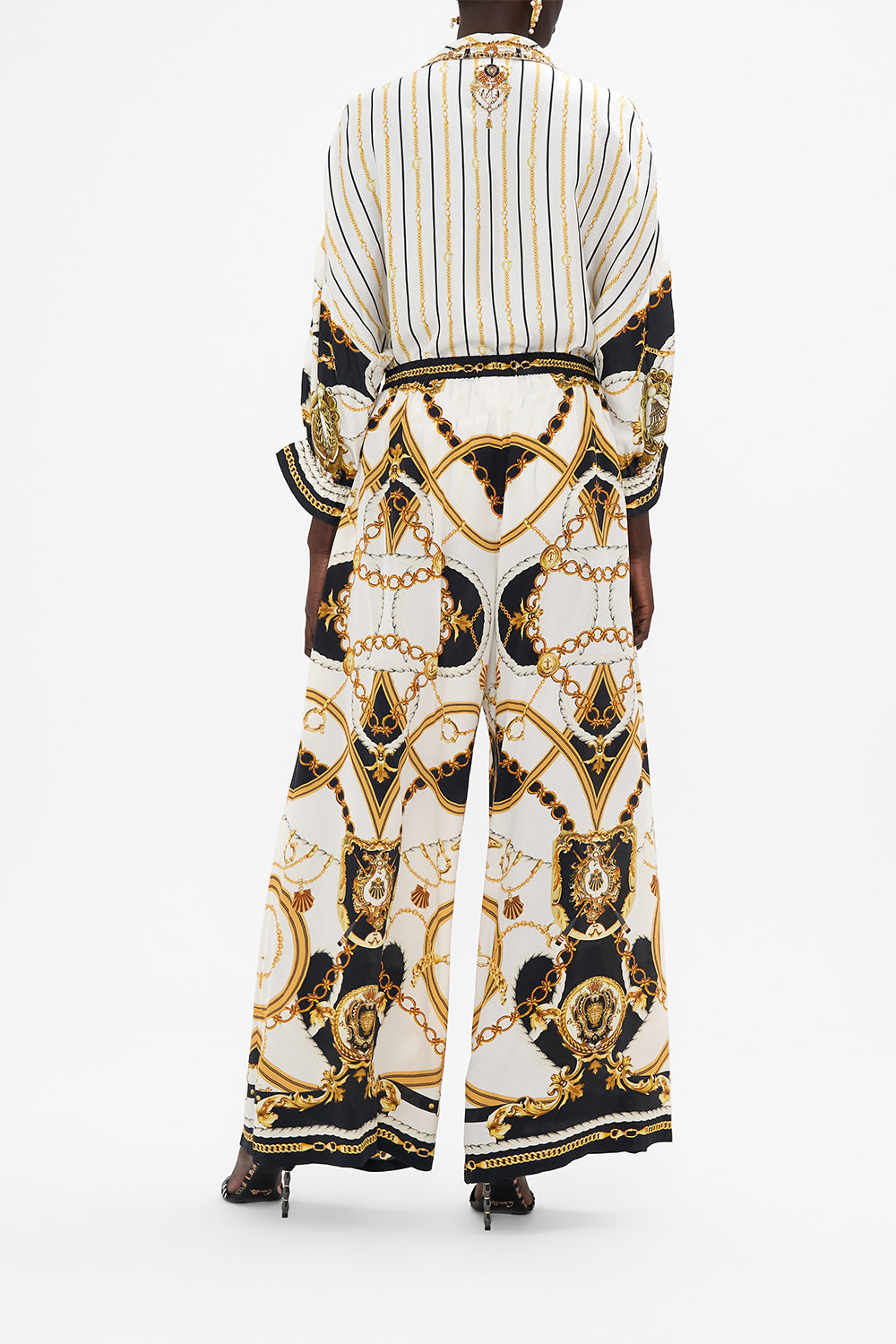 Back view of model wearing CAMILLA silk shirt in Sea Charm print