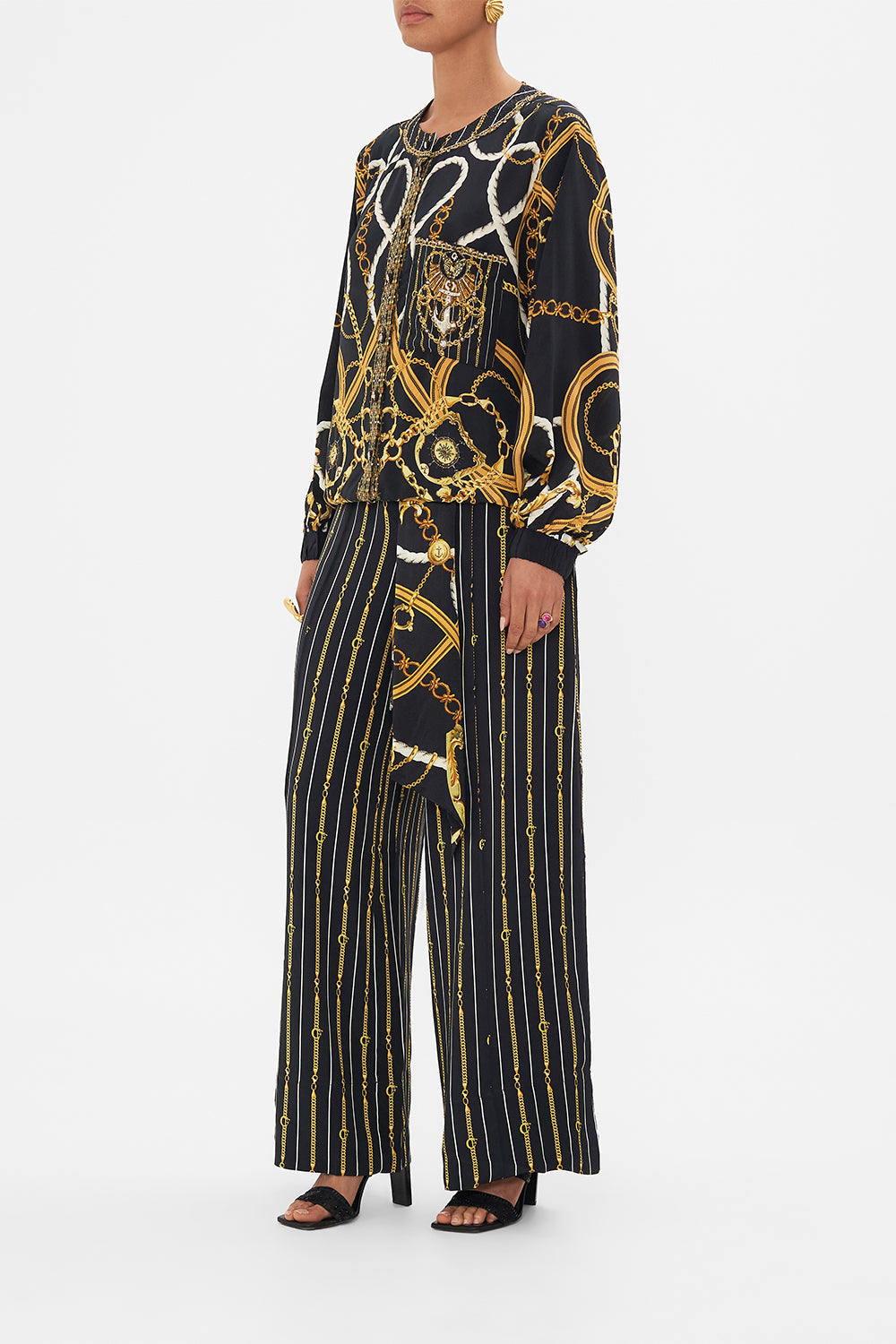 Side view of model wearing CAMILA silk bomber jacket in Coast to Coast print