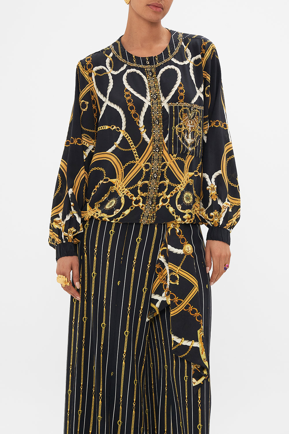 Crop view of model wearing CAMILA silk bomber jacket in Coast to Coast print