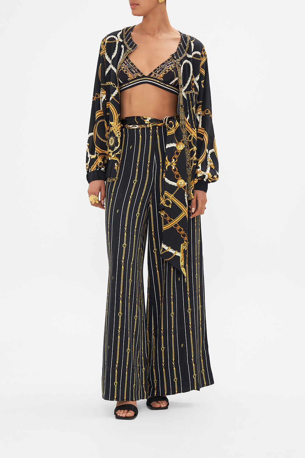 Detail view of model wearing CAMILA silk bomber jacket in Coast to Coast print