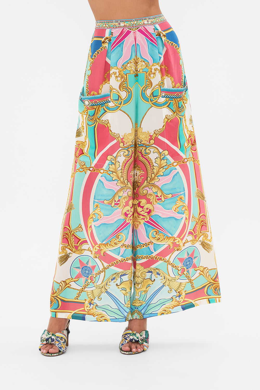 Crop view of model wearing CAMILLA silk trouser in Sail Away With Me print