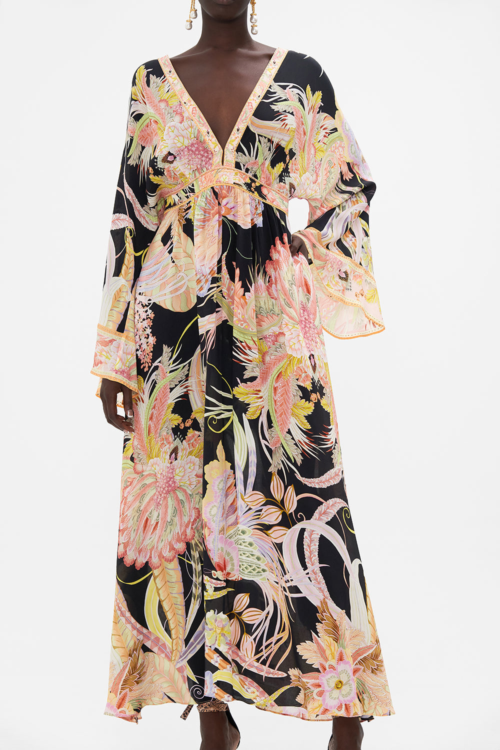 Crop view of model wearing CAMILLA designer silk dress in Lady Of The Moon print