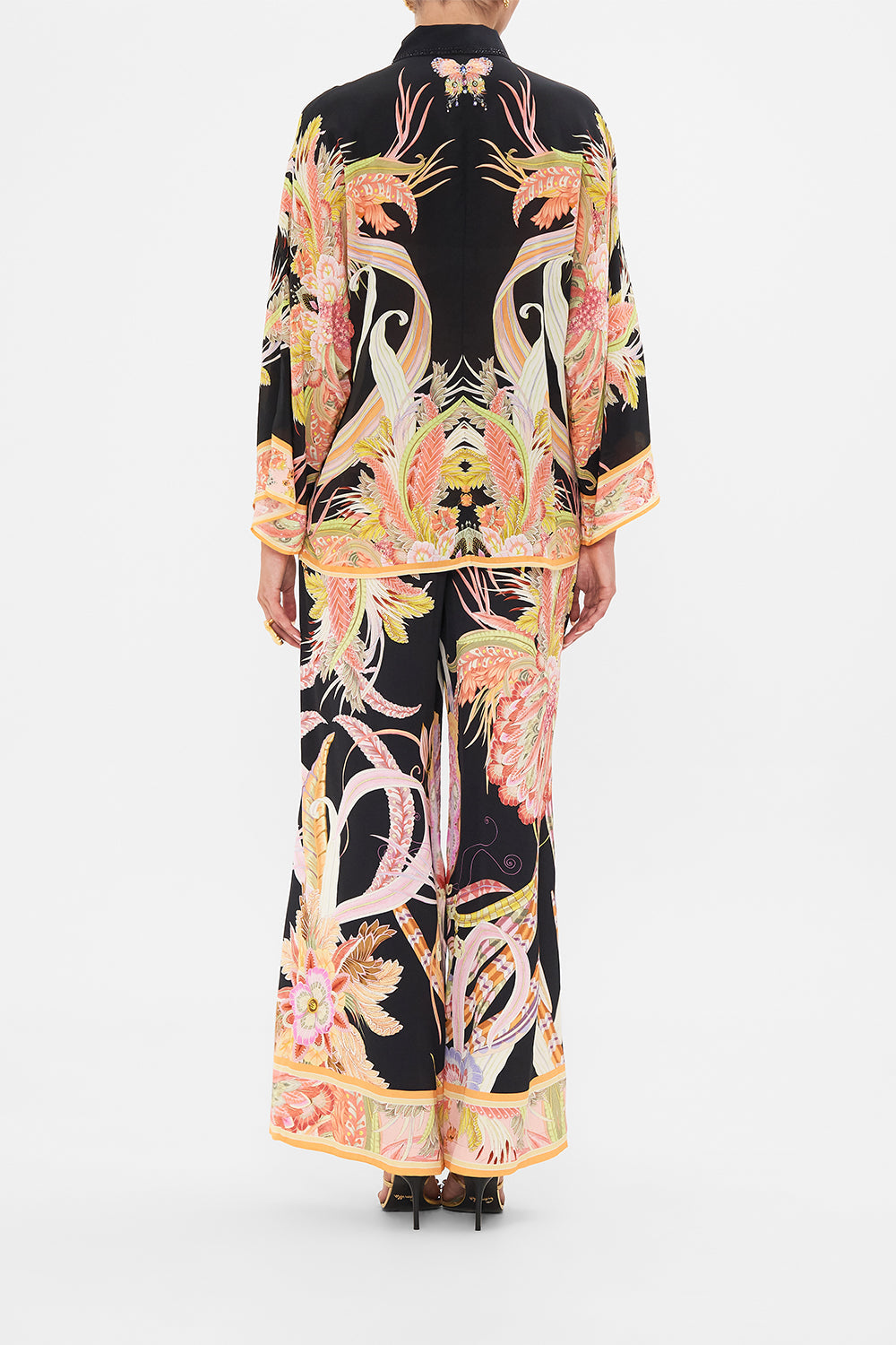 Back view of model wearing CAMILLA silk blouse in Lady Of The Moon print