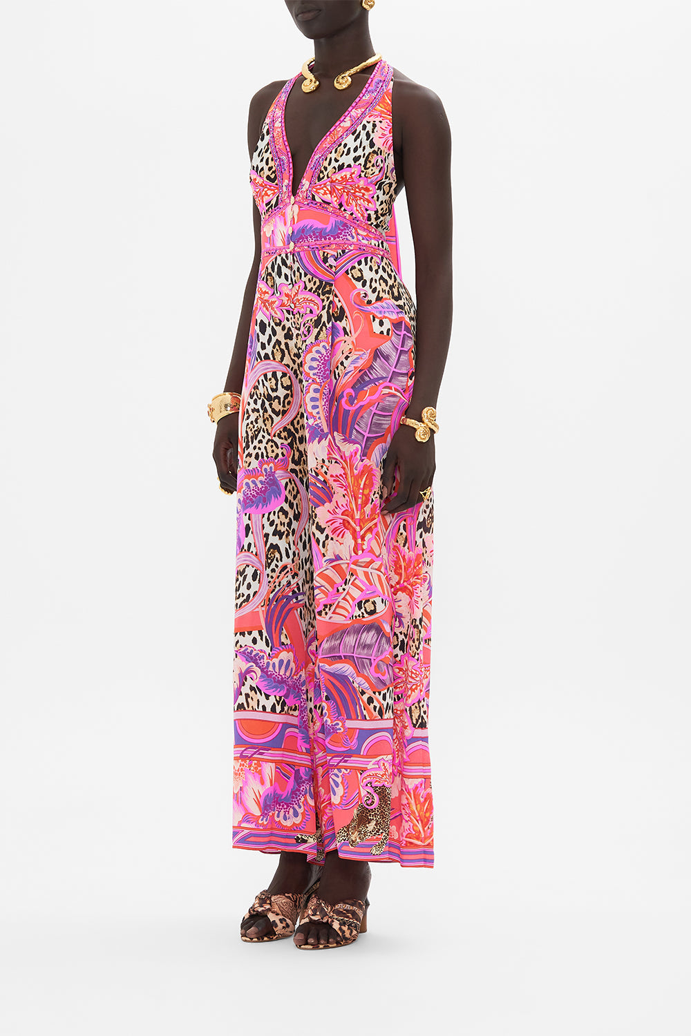 Side view of model wearing CAMILLA silk halterneck jumpsuit in Viola Vintage print