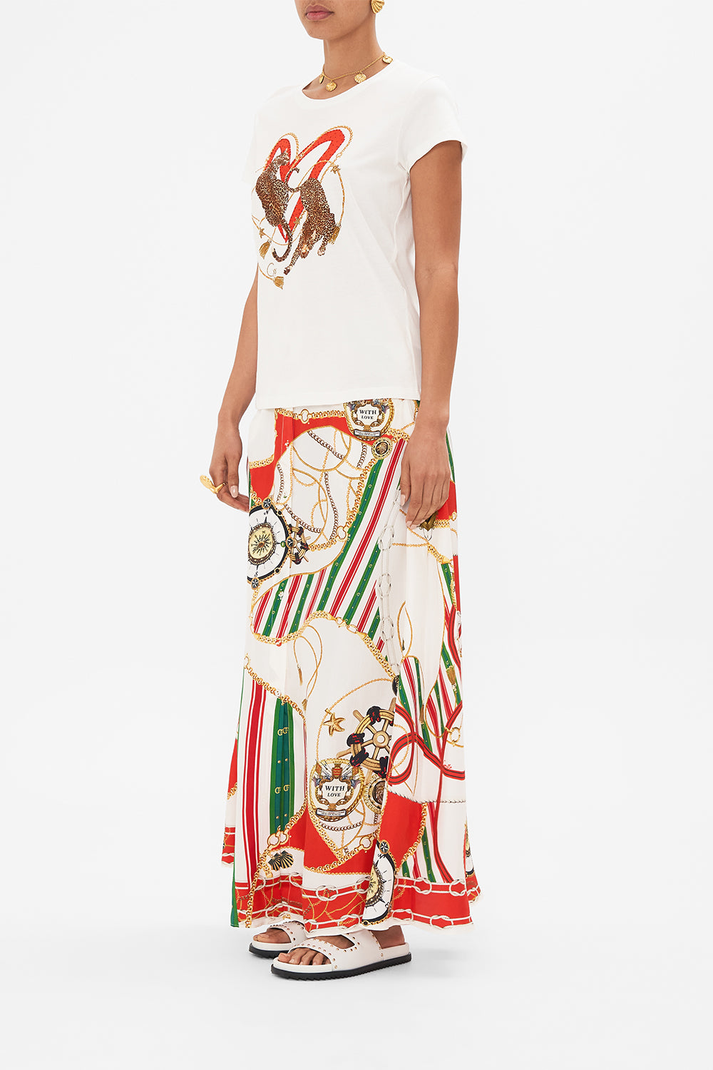 Side view of model wearing CAMILLA womenswhite t shirt in Saluti Summertime print