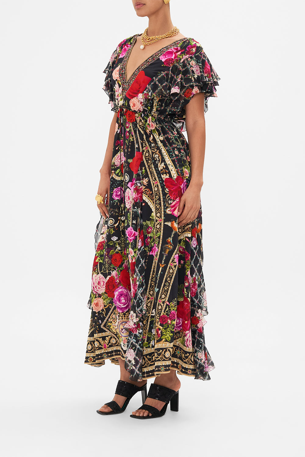 Side view of model wearing CAMILLA designer floral ruffle dress in Reservation For Love print