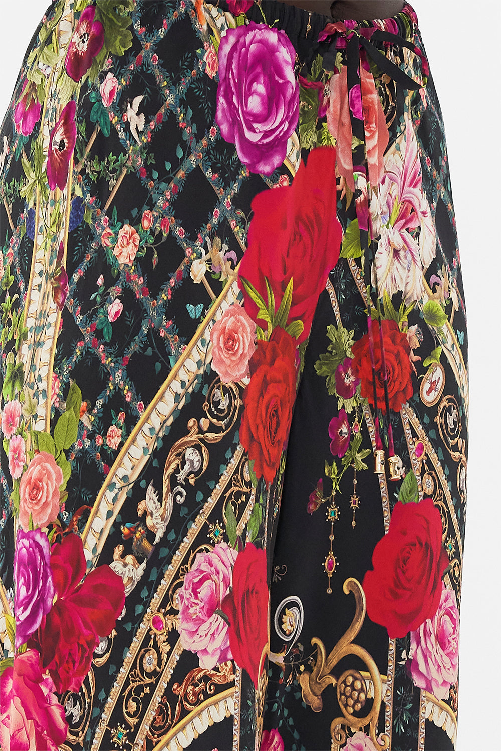 Detail view of model wearing CAMILLA drawstring silk pants in Reservation For Love