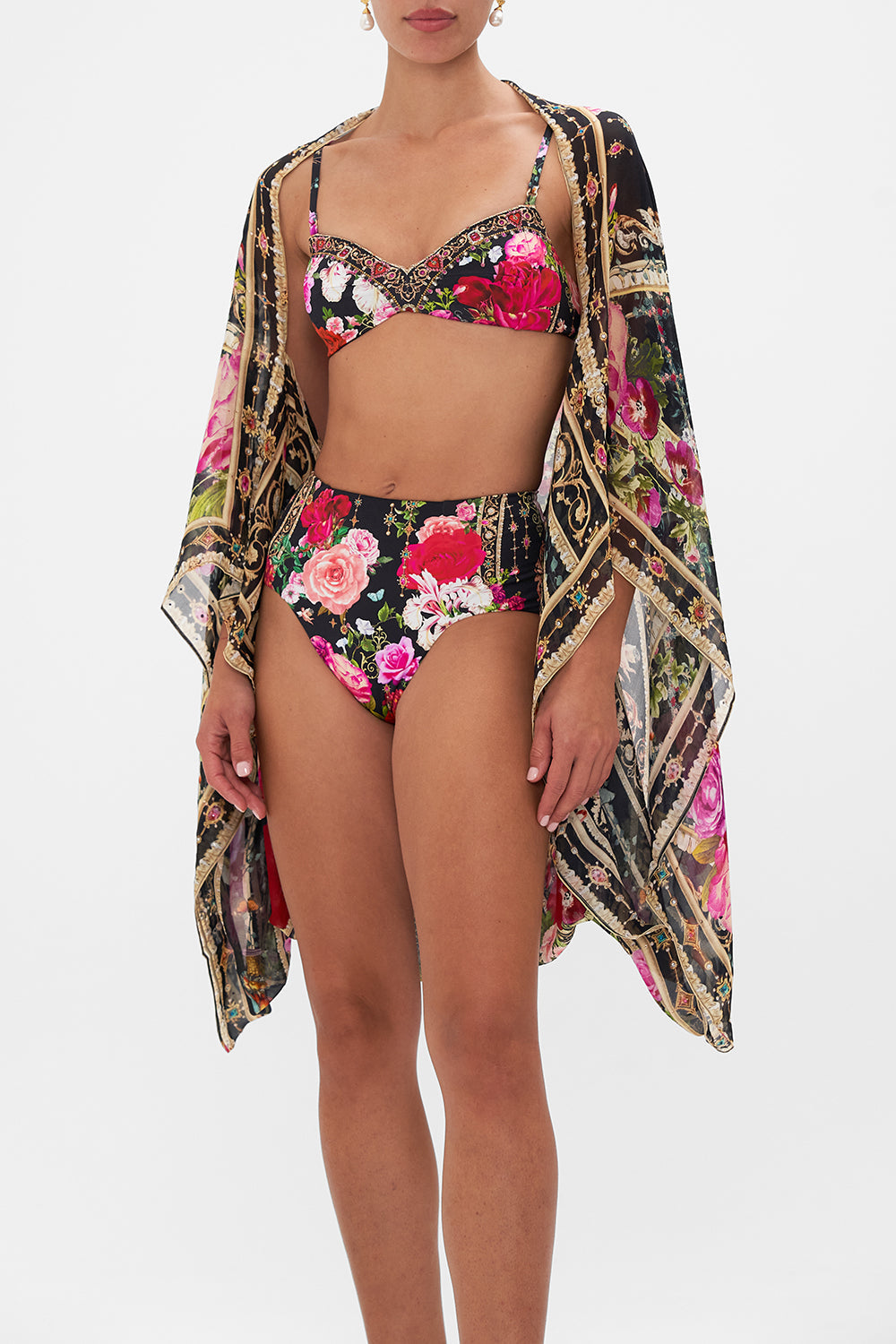 Crop view of model wearing CAMILLA floral silk shrug in Reservation for Love print