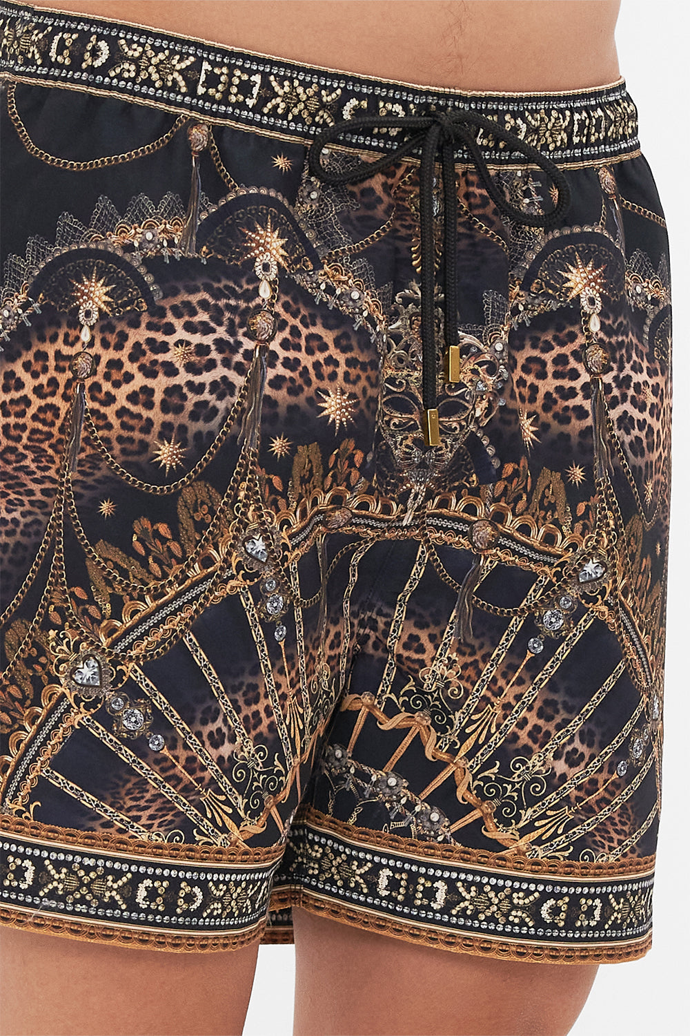 Detail view of model wearing hotel franks By CAMILLA mens boardshort in Masked At Moonlight print