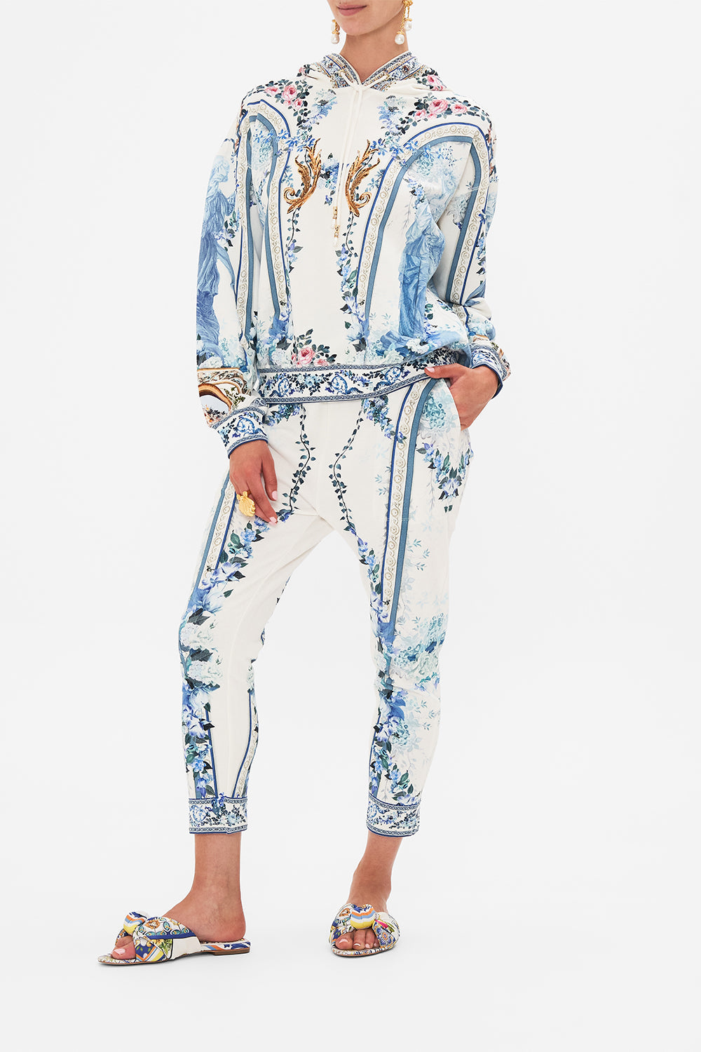 Side view of model wearing CAMILLA hoodie in Season Of The Siren print