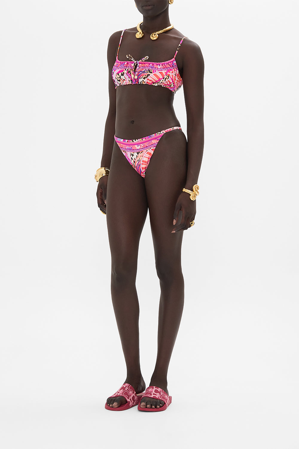 Side view of model wearing CAMILLA resortwear bikini bottom in Viola Vintage print