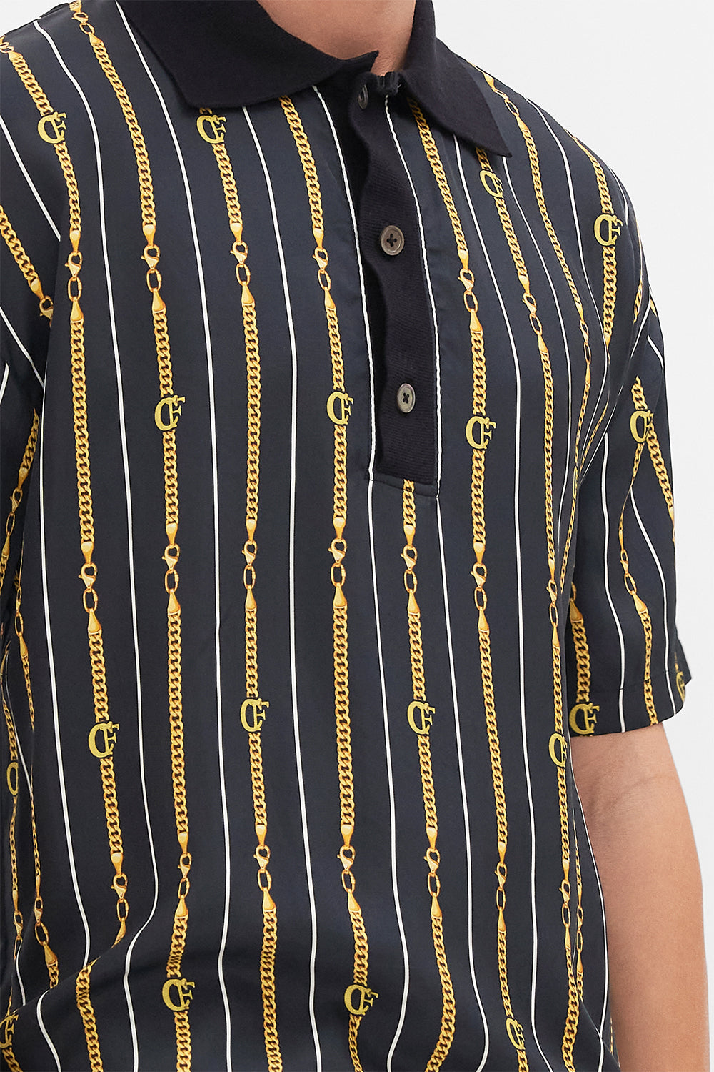 Detail view of model wearing Hotel Franks by CAMILLA mens shirt sleeve polo shirt in Coast to Coast print