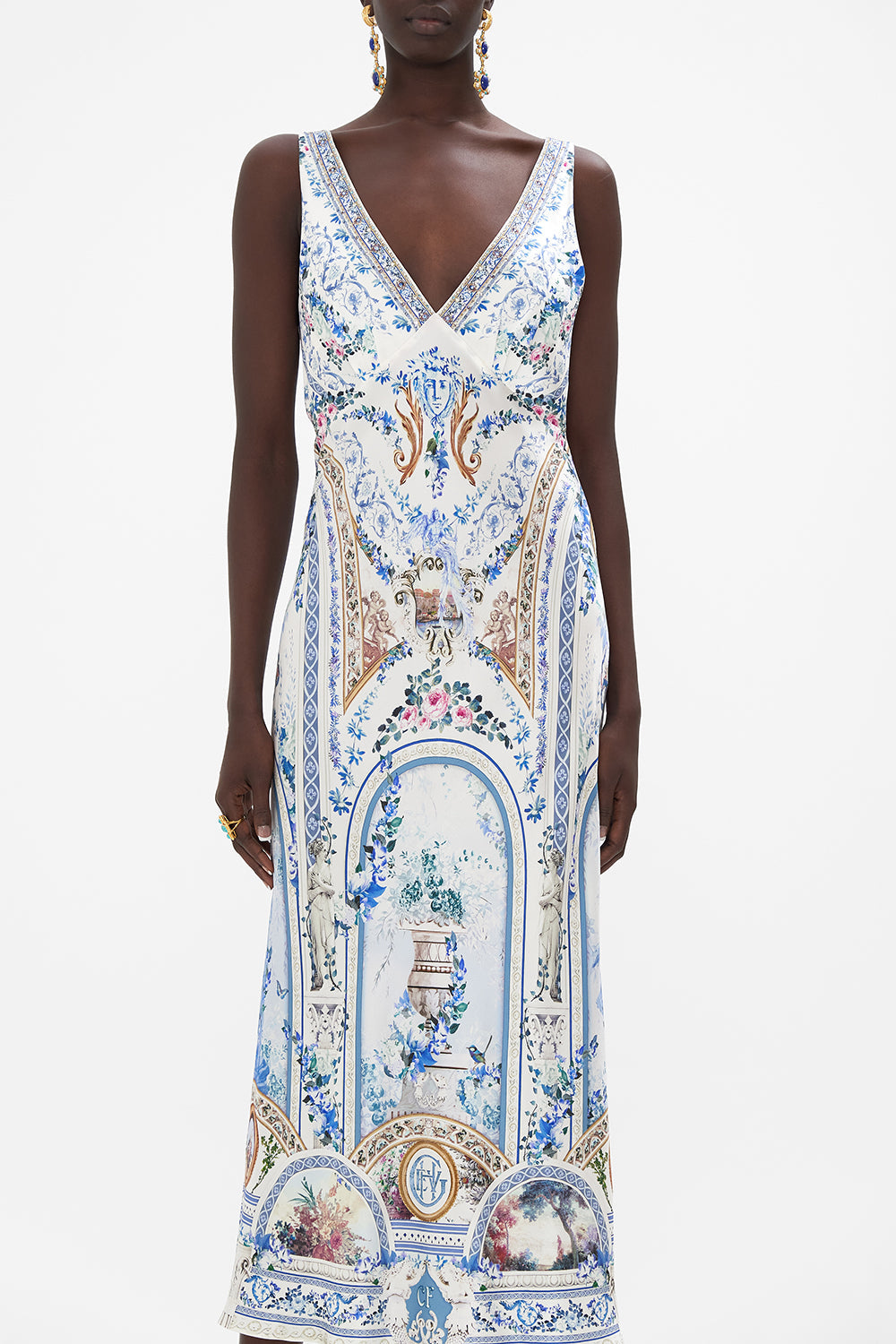 Crop view of model wearing CAMILLA silk slip dress in Season of The Siren print