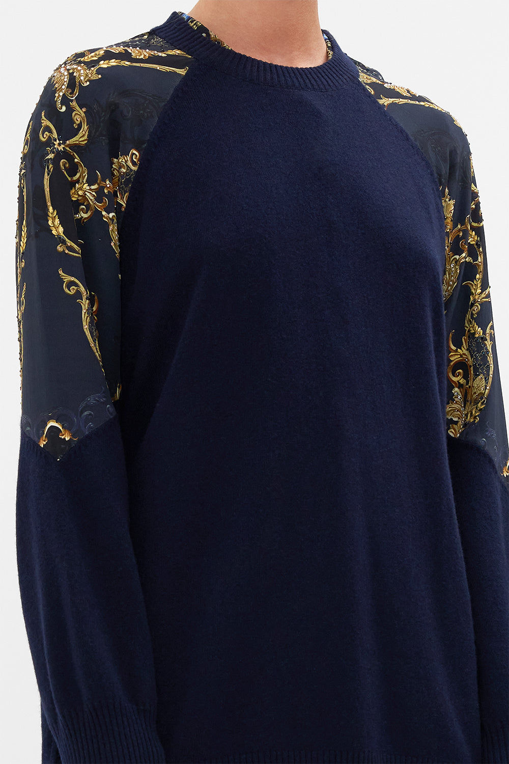 Detail view of model wearing CAMILLA navy knit jumper in Moonlight Melodies print