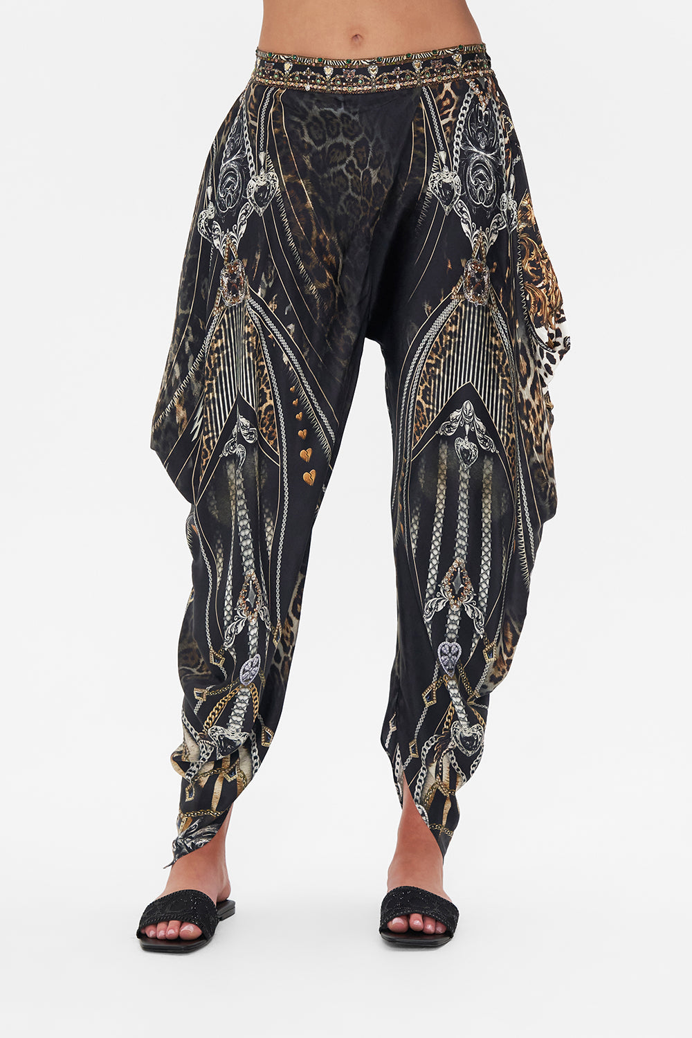 Crop view of model wearing CAMILLA drapey silk pants in Chaos In The Cosmos animal print