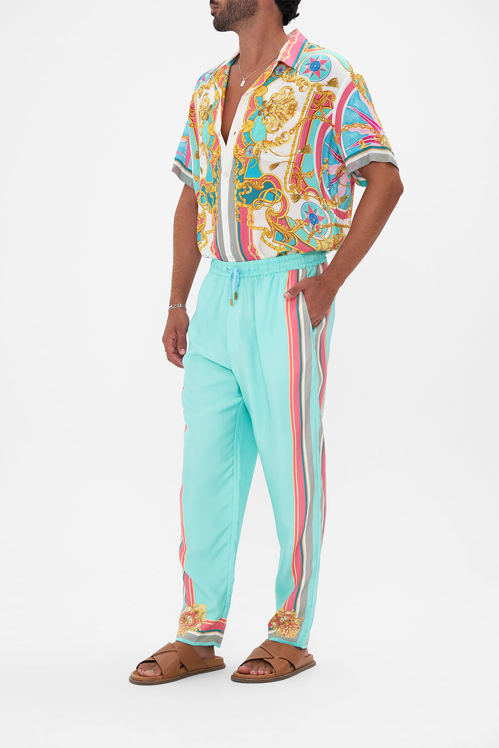 Side view of model wearing Hotel Franks by CAMILLA mens elasticated pant in Sail Away With Me print