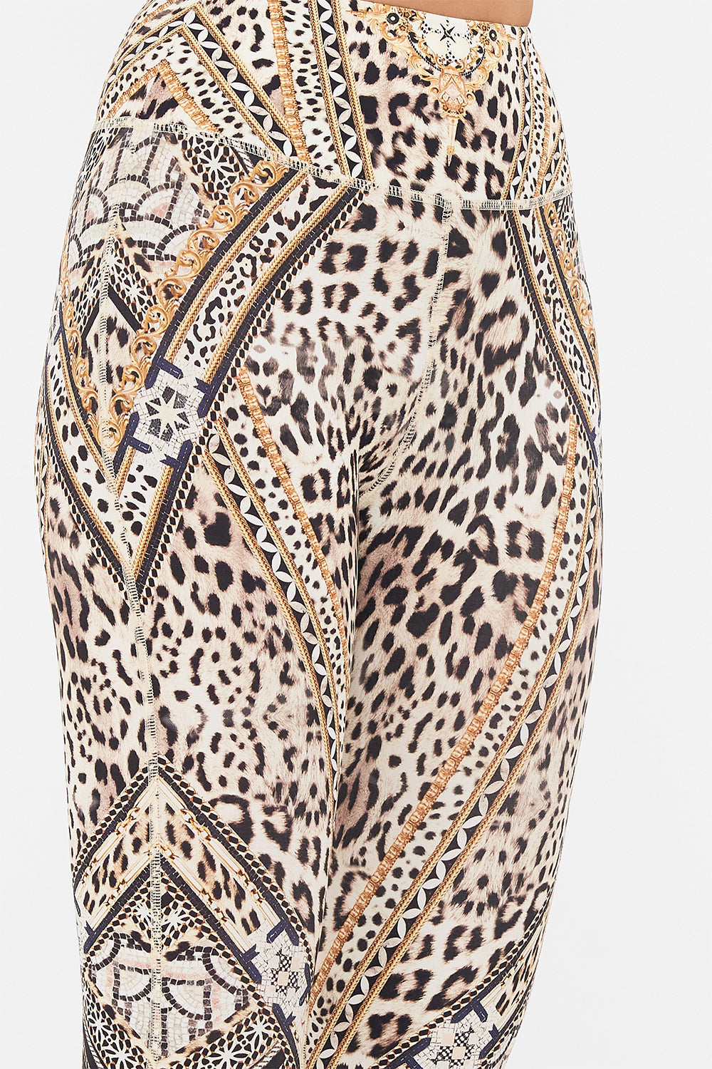Detail view of model wearing CAMILLA animal print leggings in Mosaic Muse