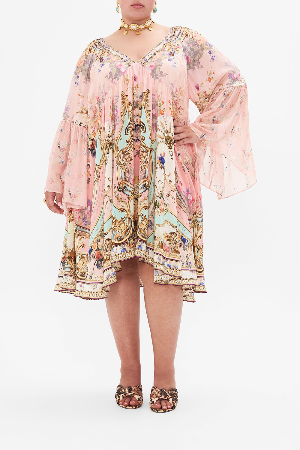 Front view of curvy model wearing CAMILLA plus size pink silk dress in Letters From The Pink Room print