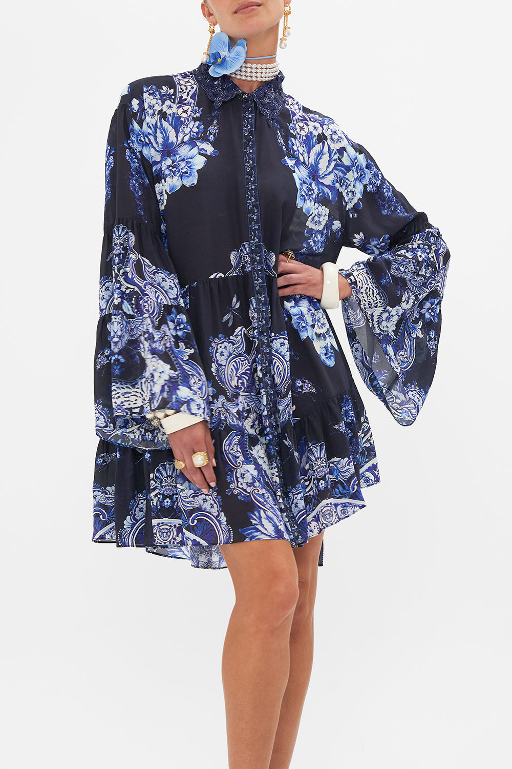 Crop view of model wearing CAMILLA silk shirt dress in Delft Dynasty print