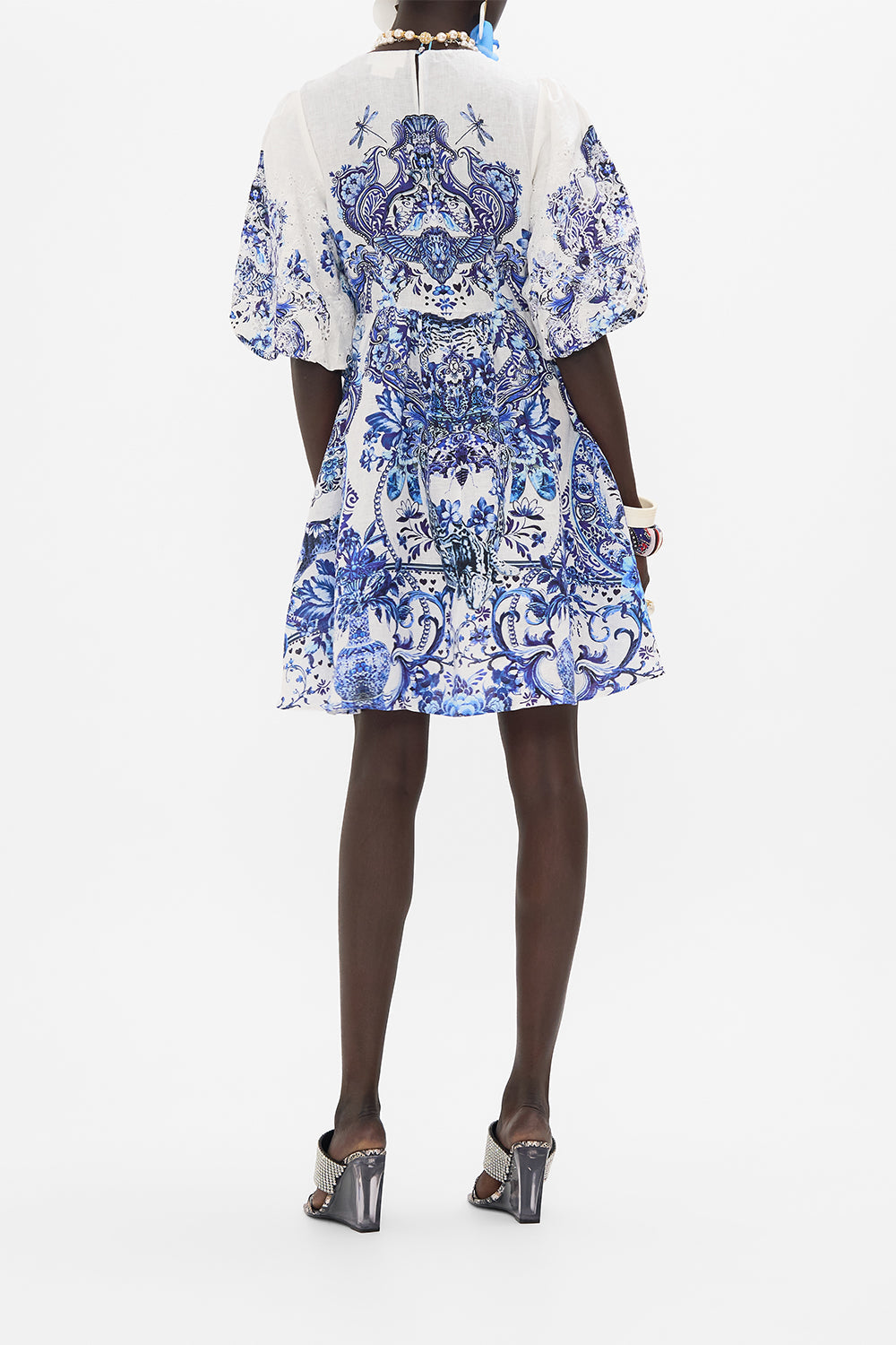 Back view of model wearing CAMILLA mini dress in Glaze And Graze print