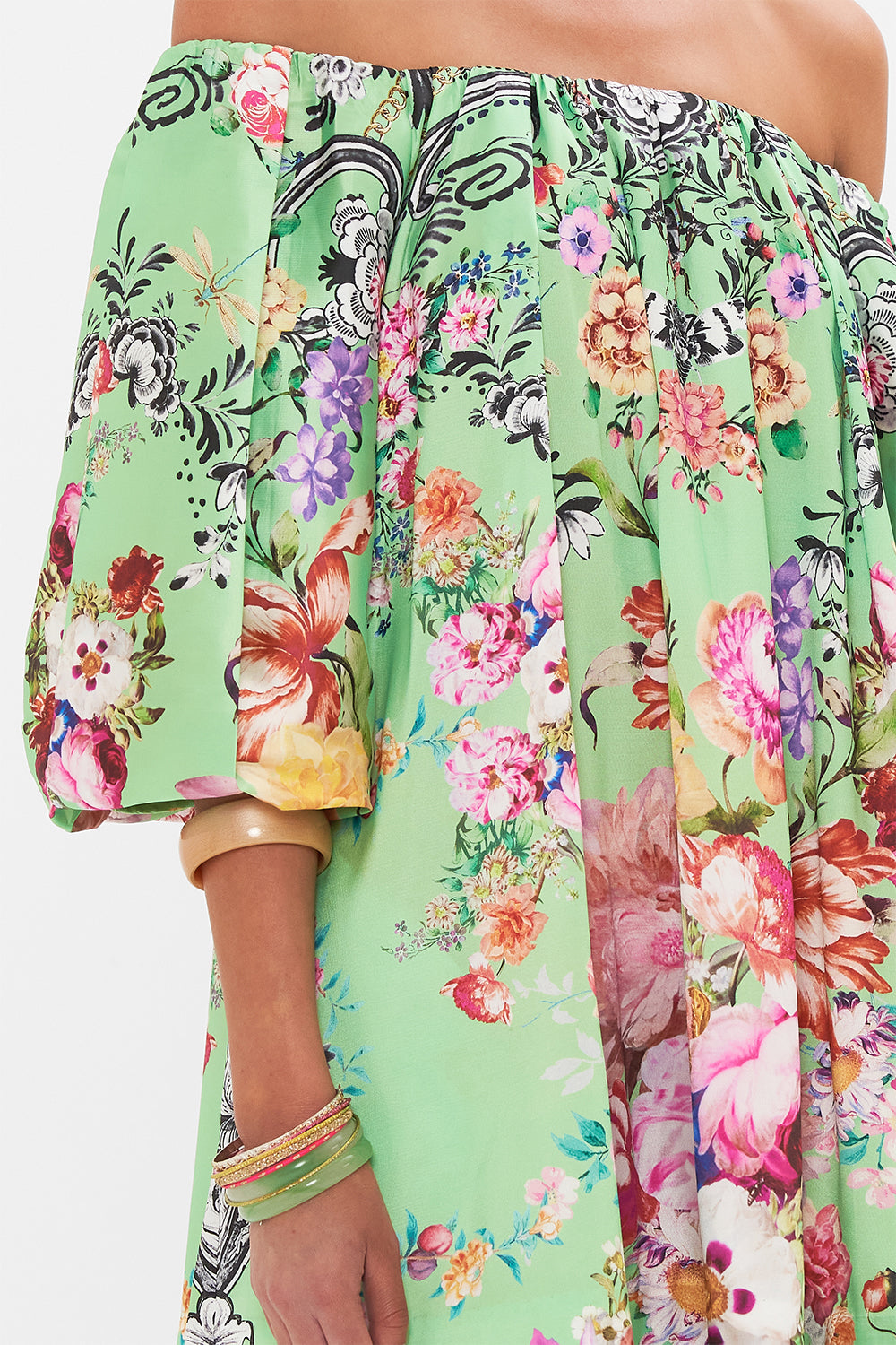 Detail view of model wearing CAMILLA pudd sleeve dress in Porcelain Dream print