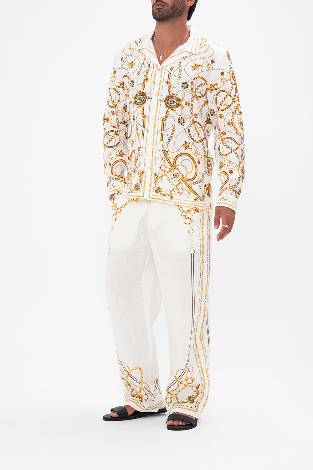 Side view of model wearing Hotel Franks By CAMILLA mens long sleeve camp collared shirt in Coast To Coast print