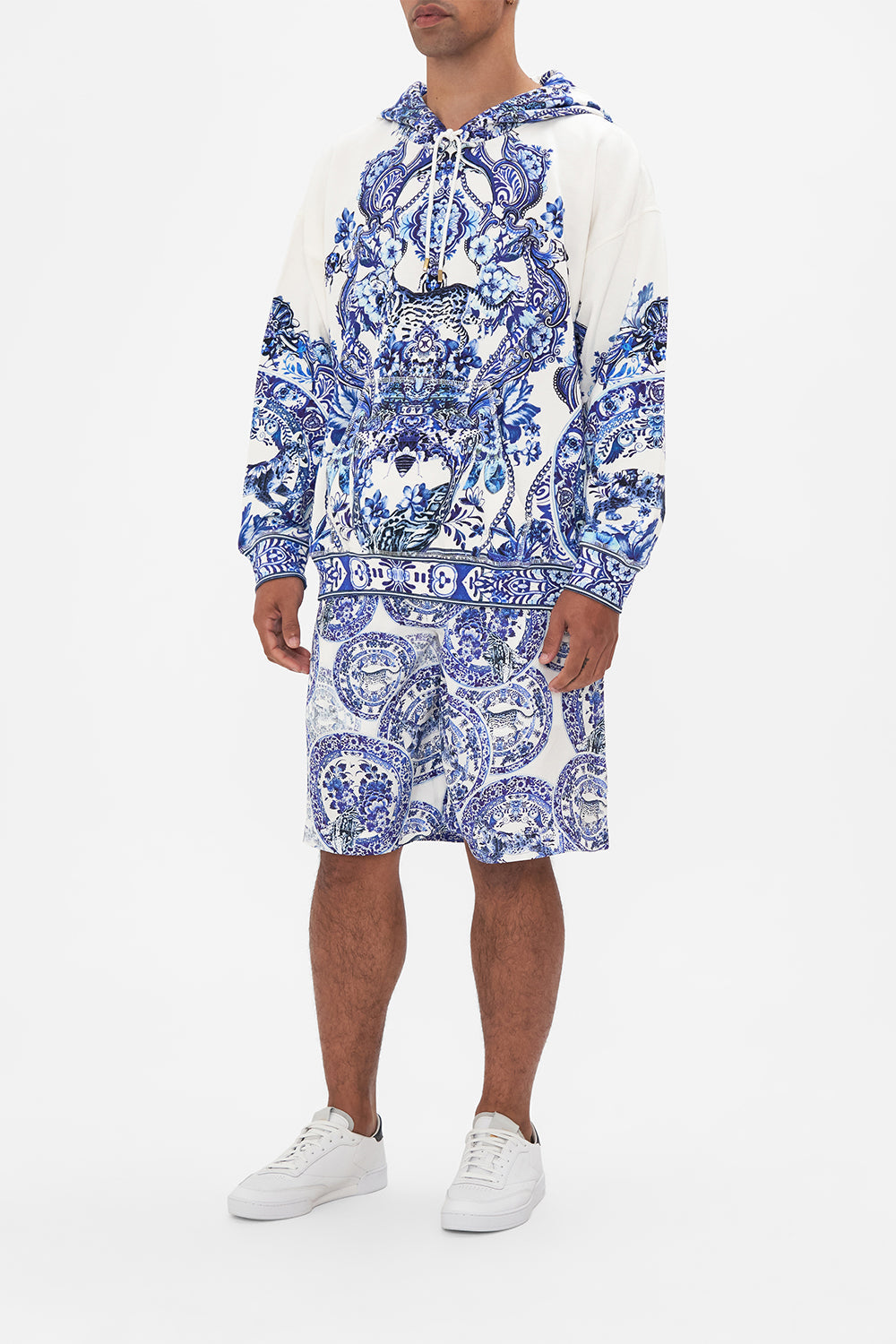 Side view of model wearing Hotel Franks by CAMILLA mens oversized hoodie in Glaze and Graze print